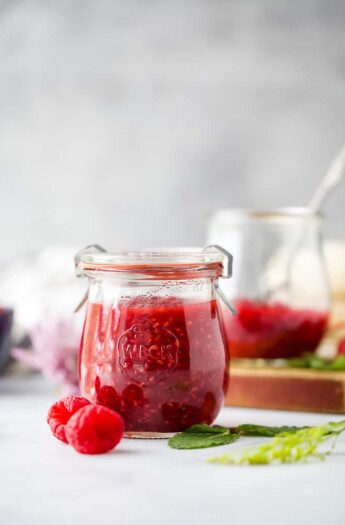 side photo of jar filled with Homemade Raspberry Jam Recipe