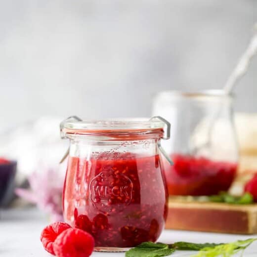 side photo of jar filled with Homemade Raspberry Jam Recipe