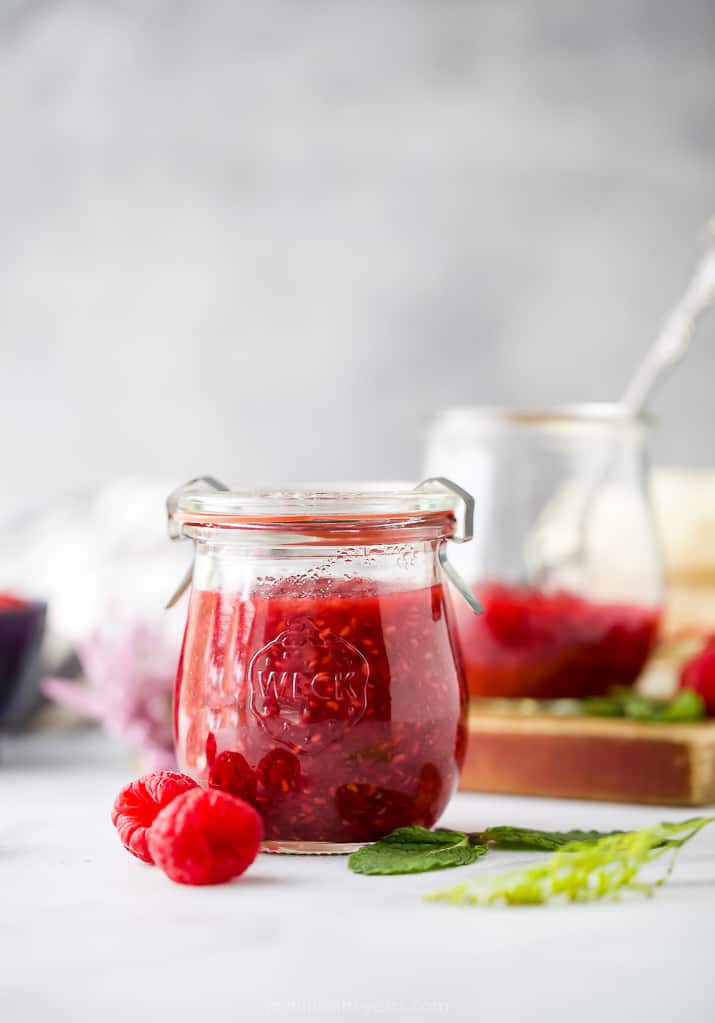 side photo of jar filled with Homemade Raspberry Jam Recipe