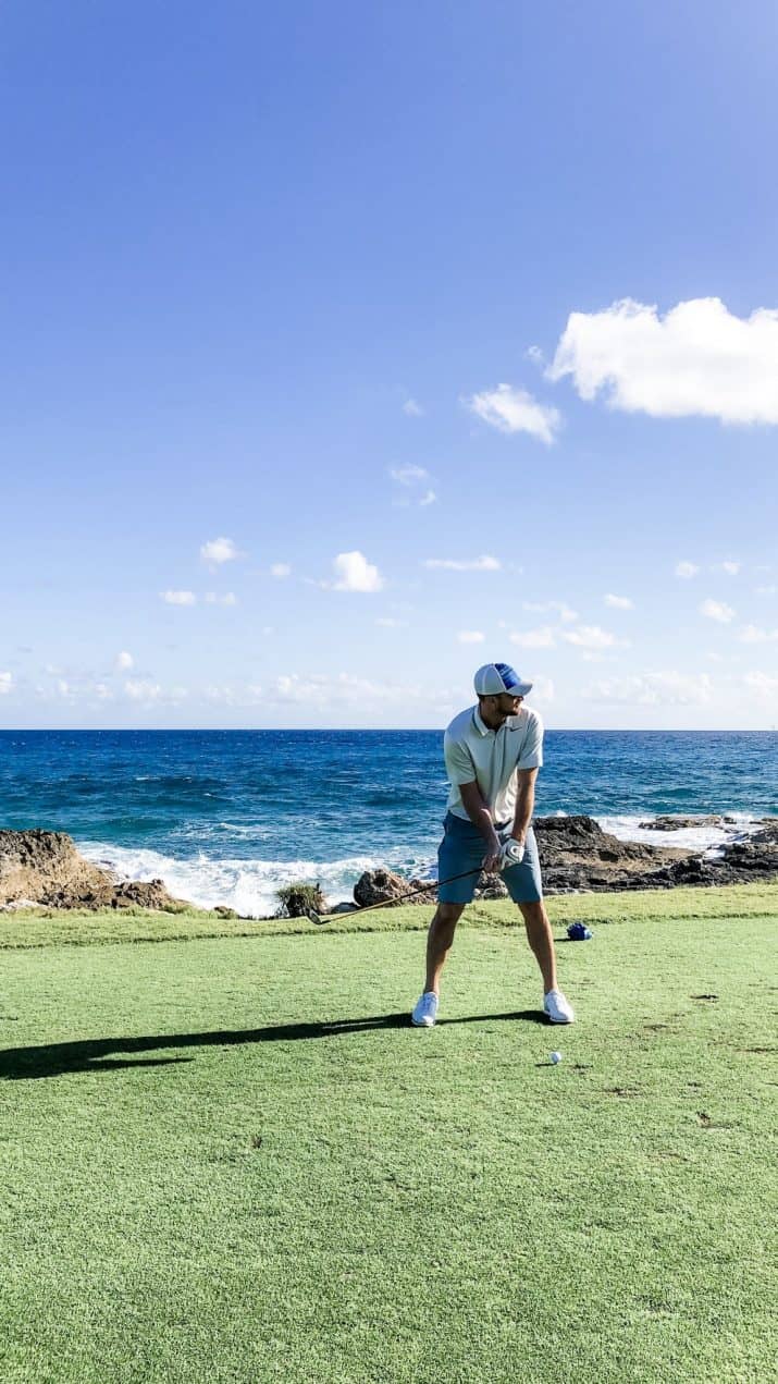 picture of a golfer getting ready to swing his club on beautiful bahamas golf course