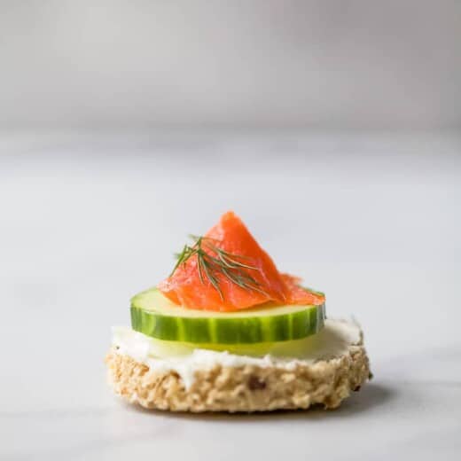 a single smoked salmon cucumber tea sandwiches