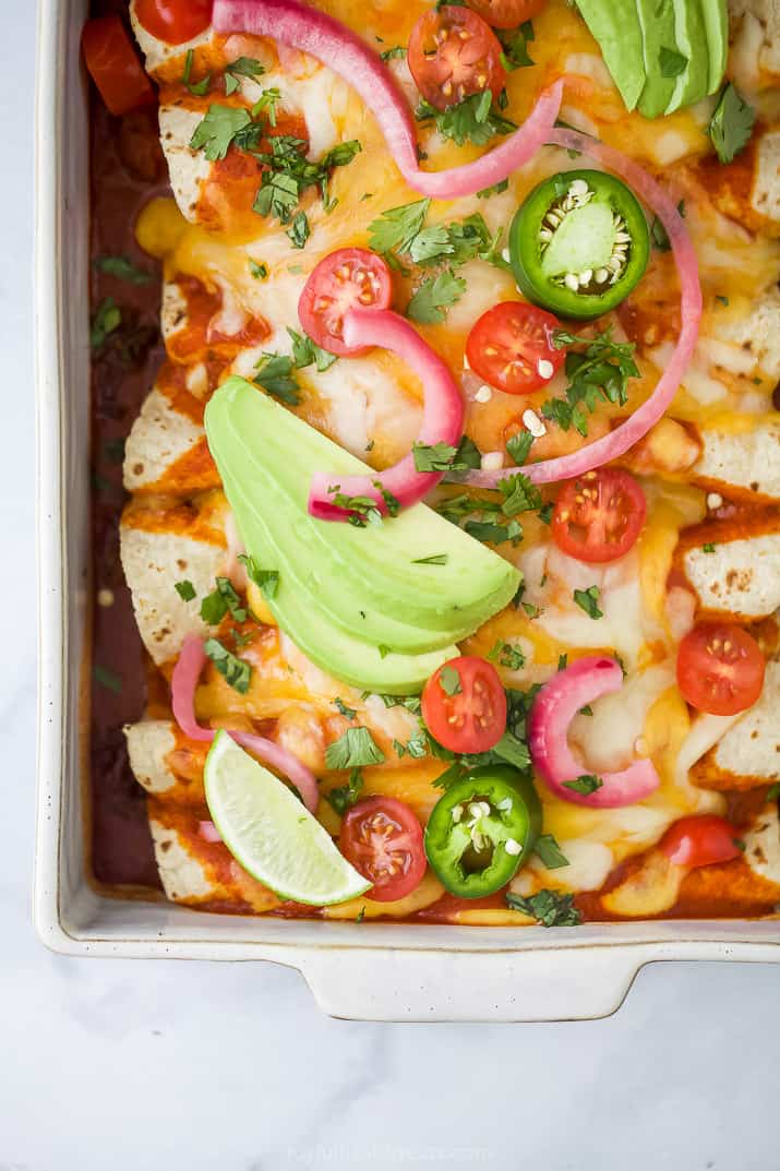 overhead photo of The Ultimate Ground Beef Enchilada Recipe with toppings
