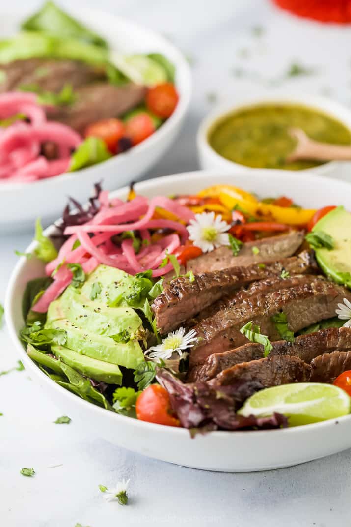 side photo of grilled fajita steak salad with chimichurri dressing