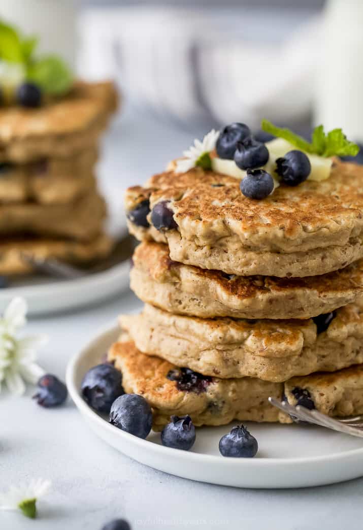 close up photo of healthy vegan blueberry pancakes on a plate