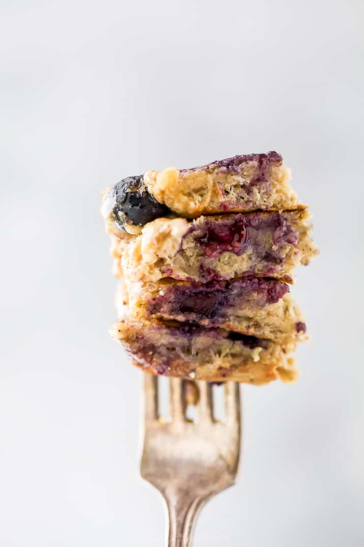 healthy vegan blueberry pancakes stacked up on a fork
