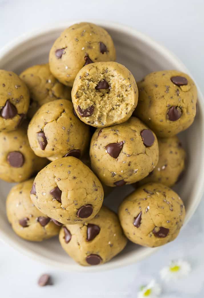 close up photos of Vegan Cookie Dough Energy Balls in a bowl