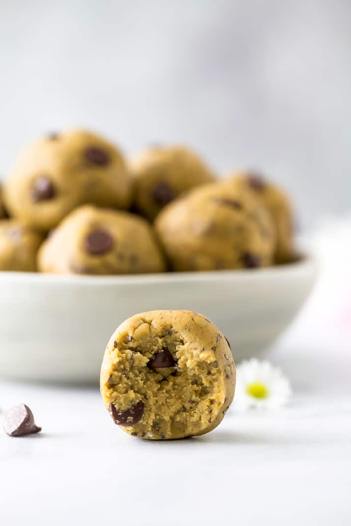 close up photo of a Vegan Cookie Dough Energy Ball with a bite taken out of it