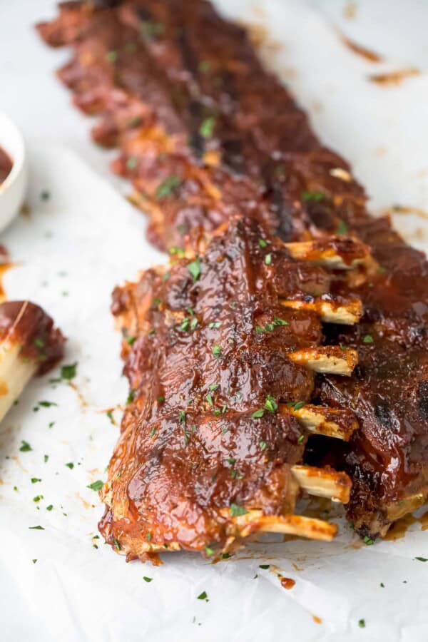 Close-up of juicy baby back ribs with BBQ glaze.