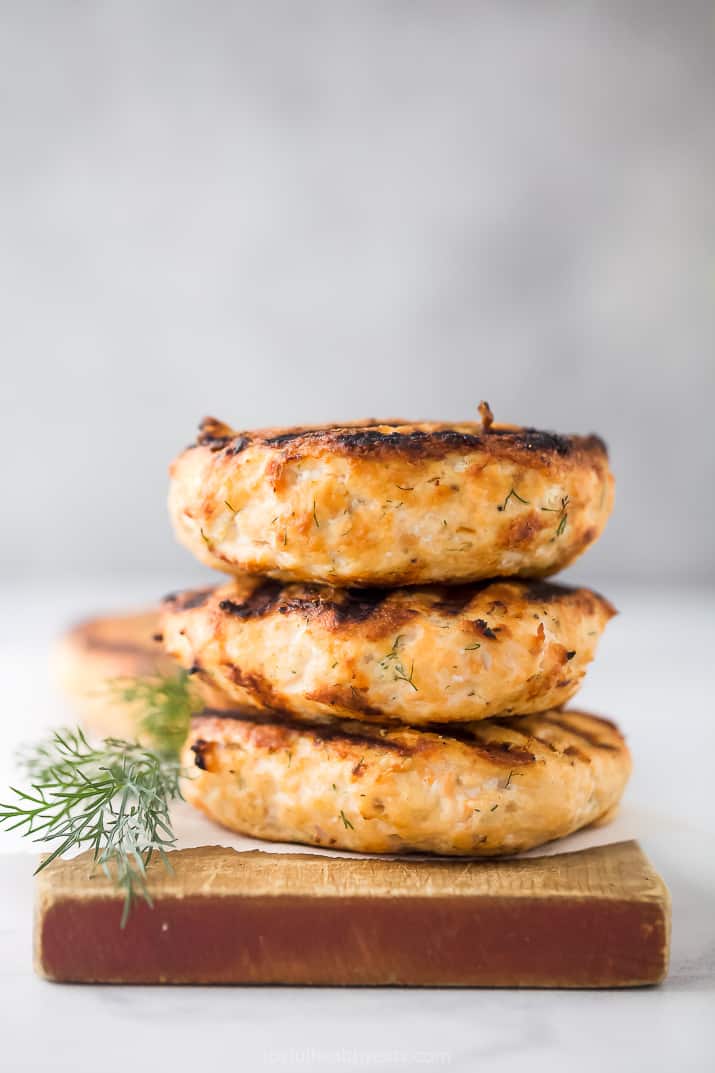 a stack of grilled salmon burgers 