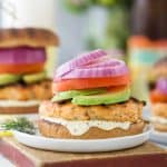 grilled salmon burger with lemon garlic aioli on a bun