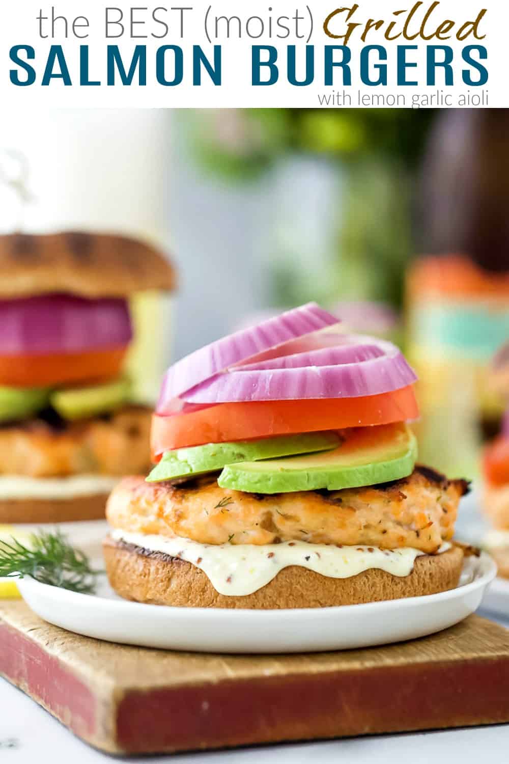 pinterest image for the best grilled salmon burgers with lemon garlic aioli