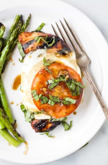 overhead photo of grilled balsamic caprese chicken on a plate