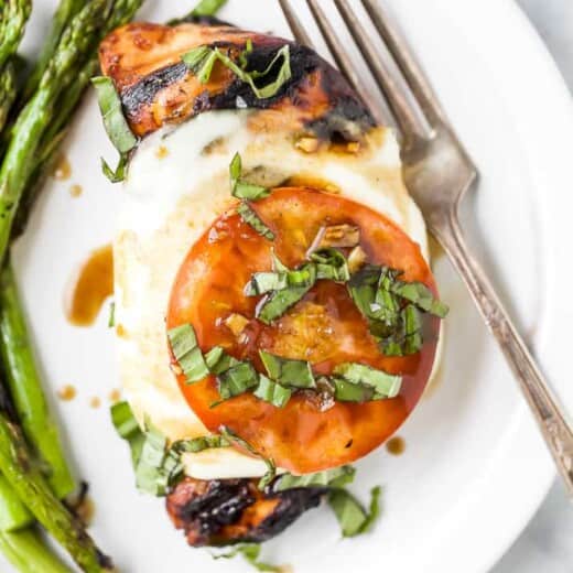 overhead photo of grilled balsamic caprese chicken on a plate