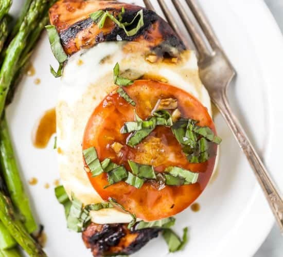overhead photo of grilled balsamic caprese chicken on a plate