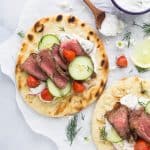 easy grilled steak gyros with tzatziki sauce and vegetables