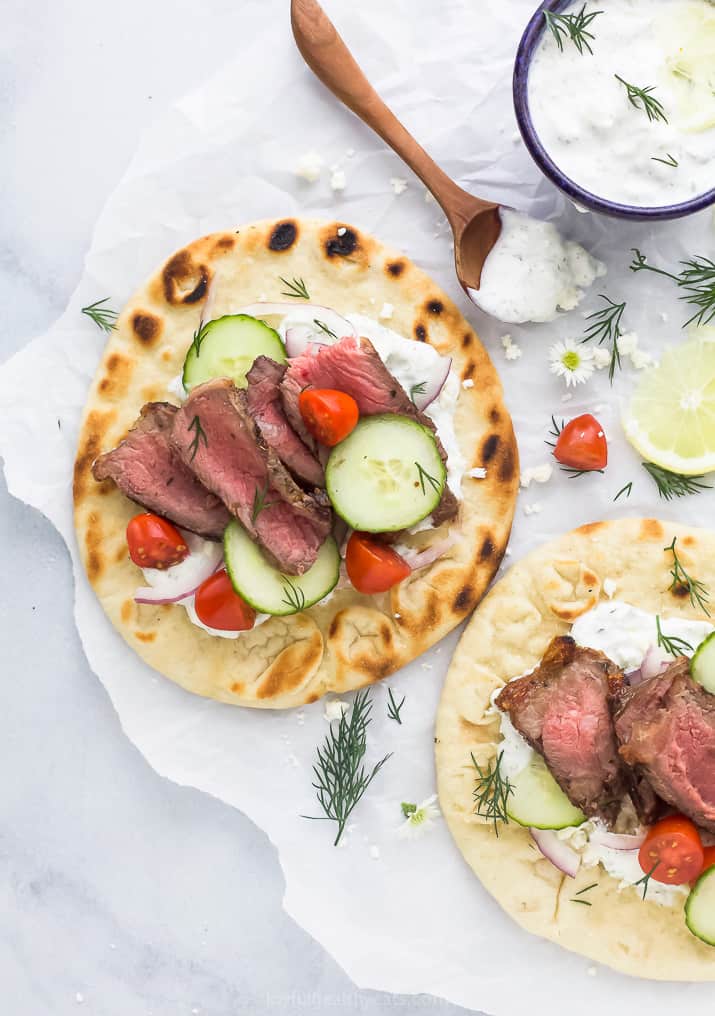 easy grilled steak gyros with tzatziki sauce and vegetables