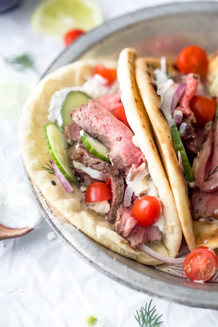 side close up photo of easy grilled steak gyros with tzatziki sauce
