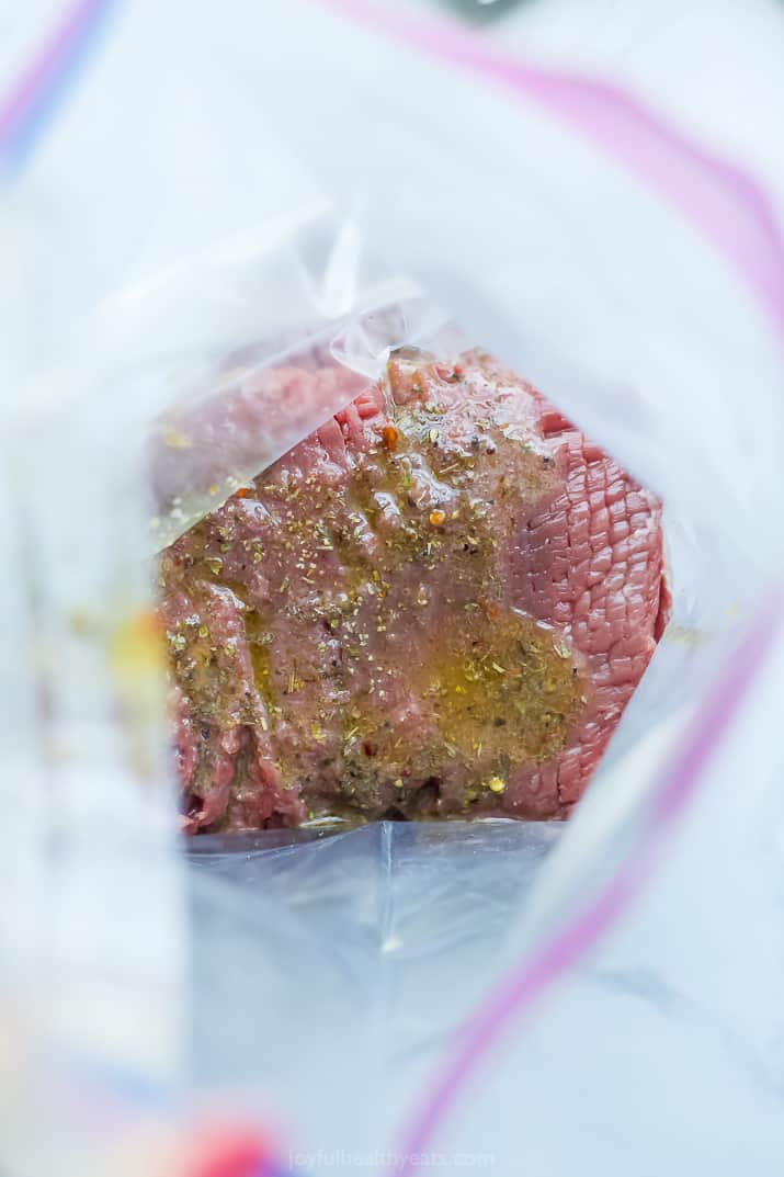 marinading mediterranean steak in a ziplock bag