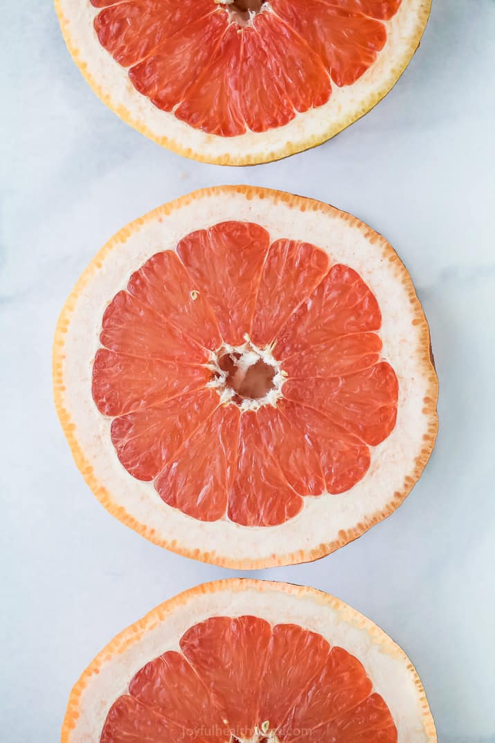 grapefruit halves on a board