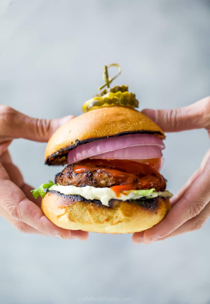 ultimate classic turkey burger being held with hands