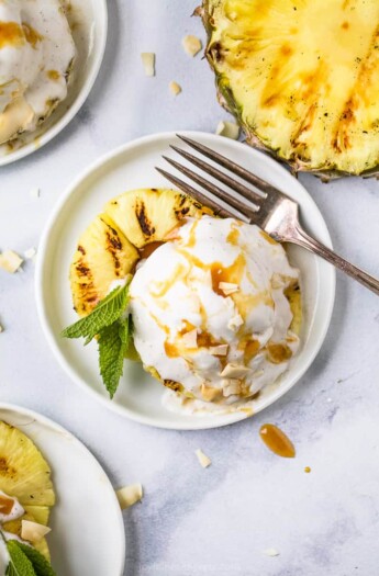 overhead photo of easy vegan grilled pineapple dessert with coconut milk ice cream