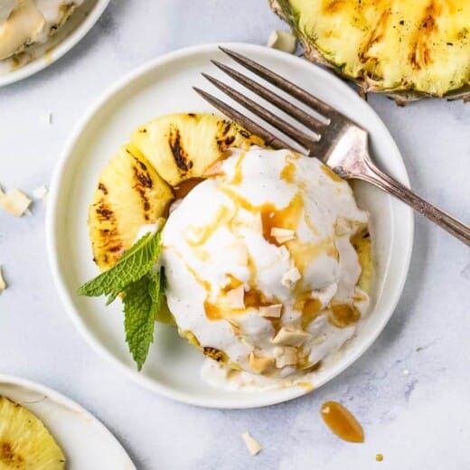 overhead photo of easy vegan grilled pineapple dessert with coconut milk ice cream