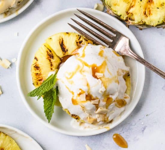 overhead photo of easy vegan grilled pineapple dessert with coconut milk ice cream