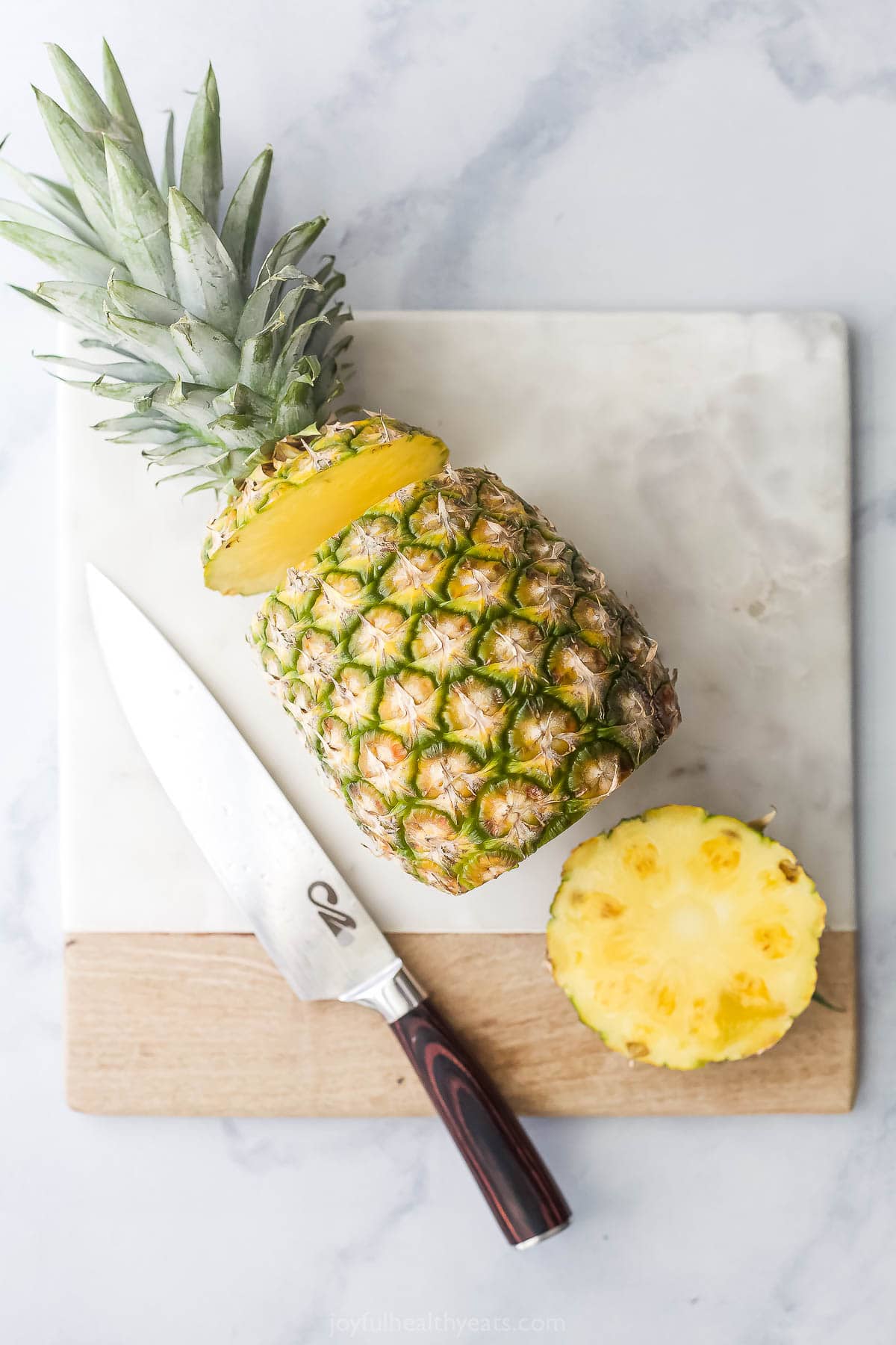 Overhead view of pineapple with top and bottom sliced off