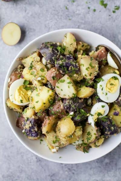 patriotic potato salad with herb dressing in a bowl