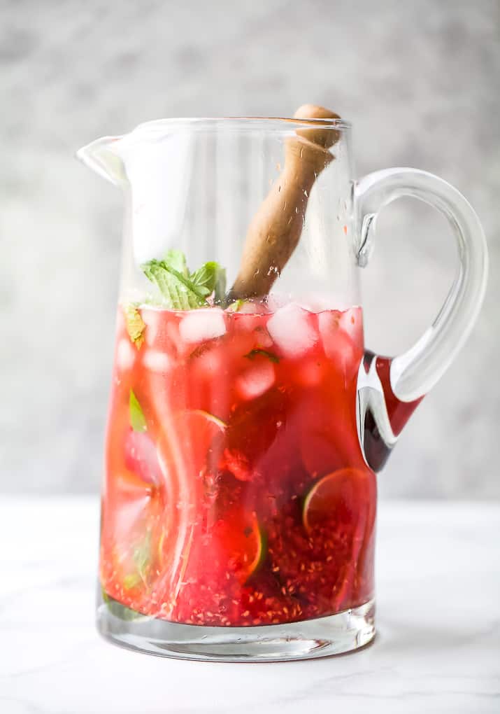 the best fresh raspberry mojito recipe in a pitcher