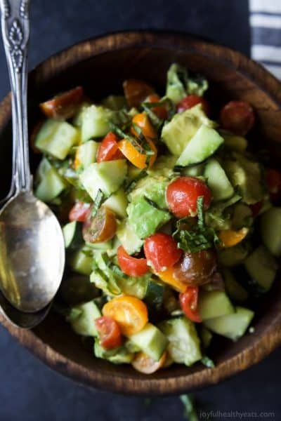 tomato avocado cucumber salad in a bowl