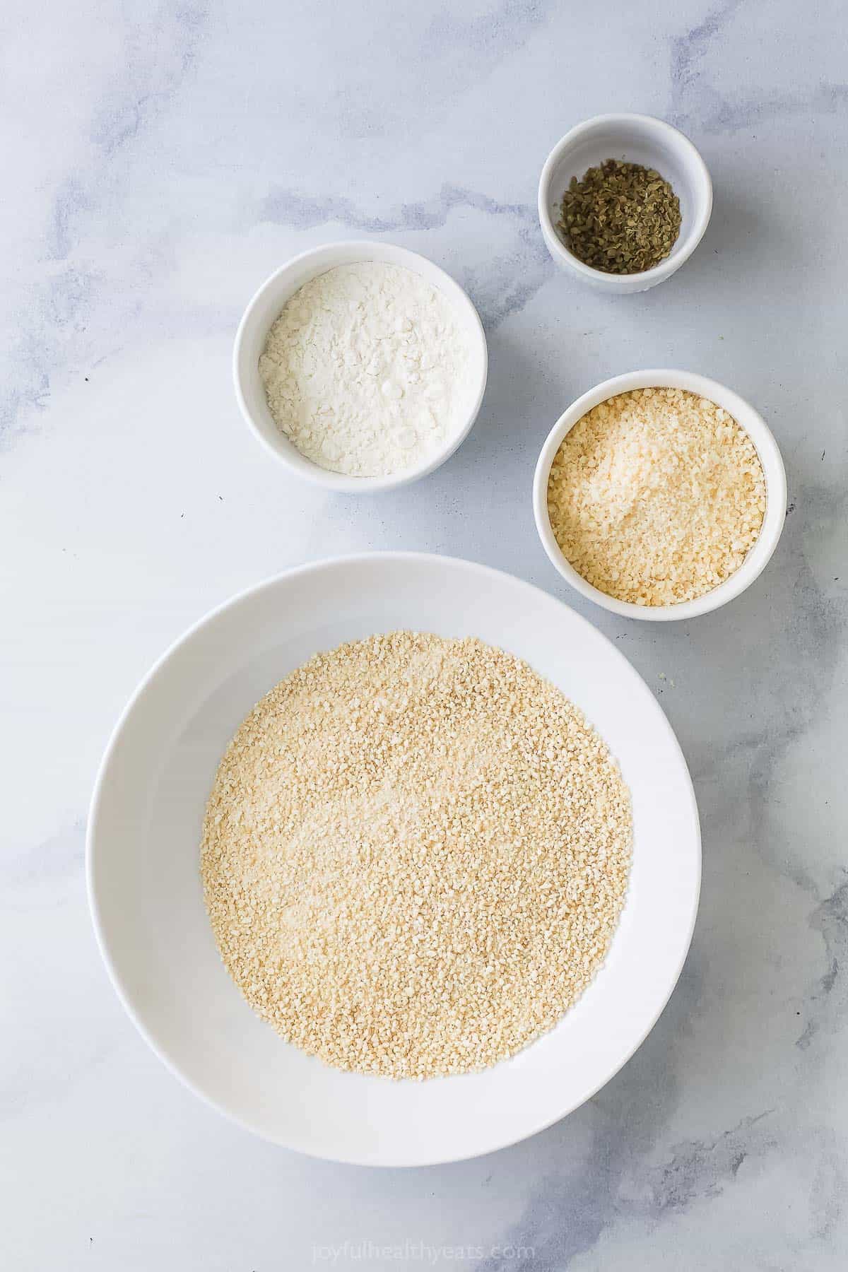 Ingredients for the breading station for healthy chicken parmesan. 