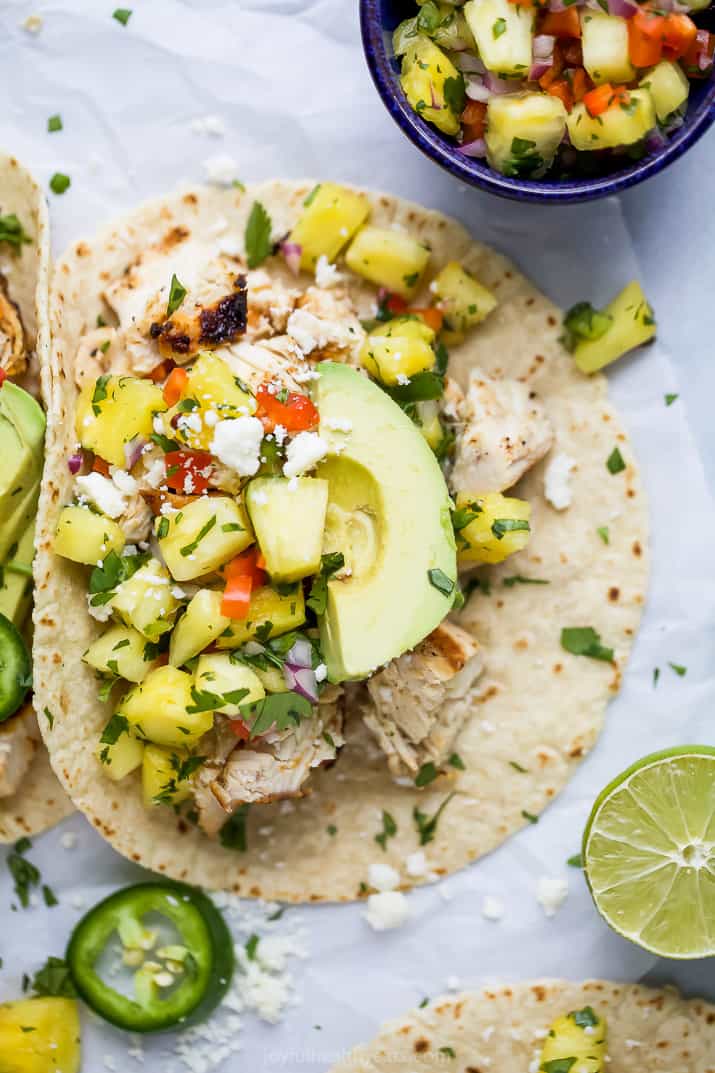 overhead photo of easy chipotle chicken tacos with pineapple salsa