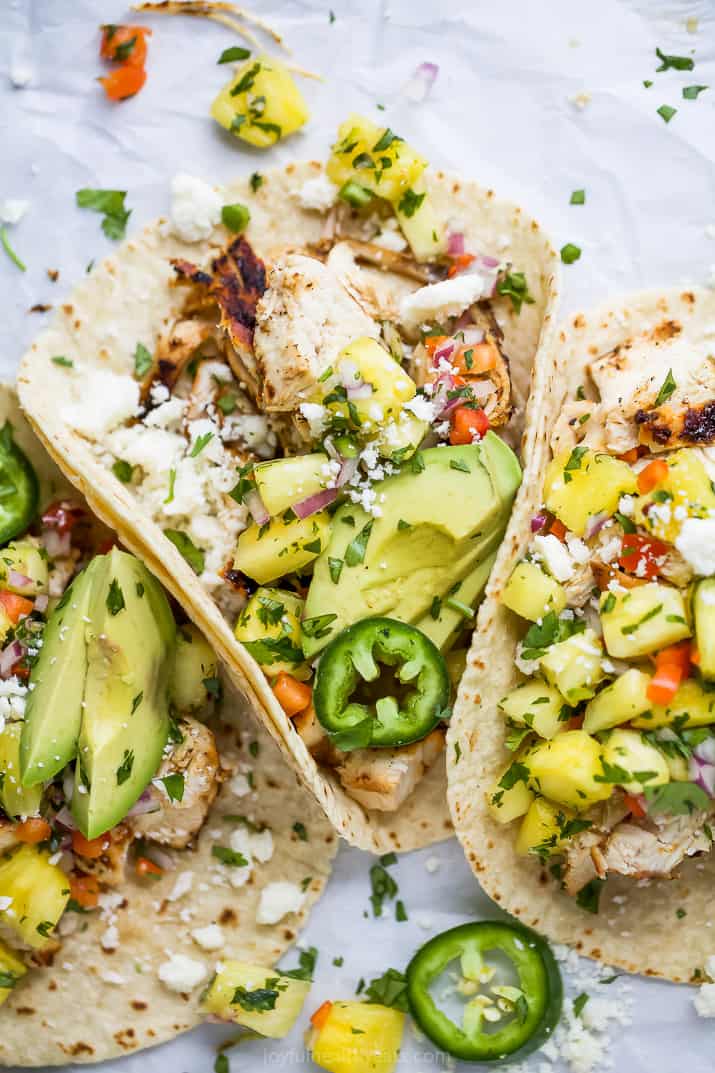 overhead photo of easy chipotle chicken tacos with pineapple salsa