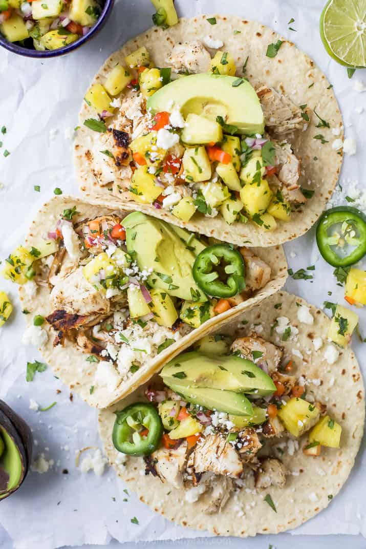 overhead photo of easy chipotle chicken tacos with pineapple salsa