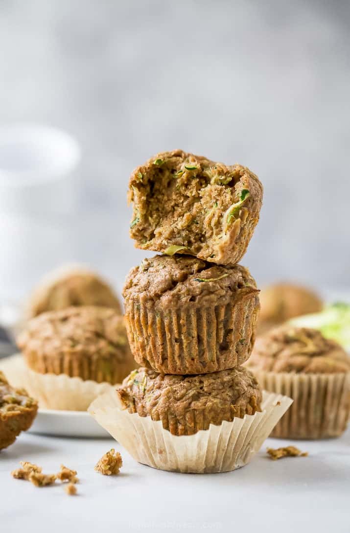 a stack of easy moist healthy zucchini muffins piled on top of each other