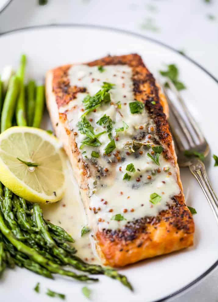 close up photo of pan seared salmon with creamy dijon sauce