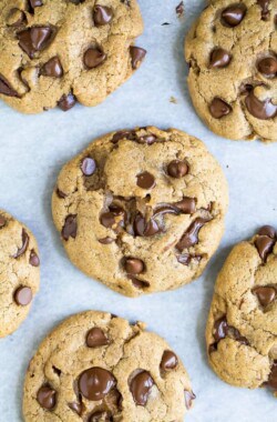 Vegan chocolate chip cookies on parchment paper.