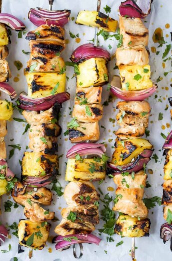 close up photo of grilled pineapple chicken kabobs