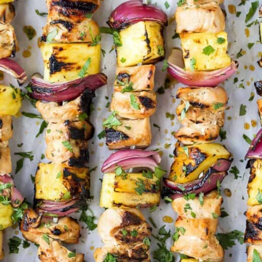 close up photo of grilled pineapple chicken kabobs