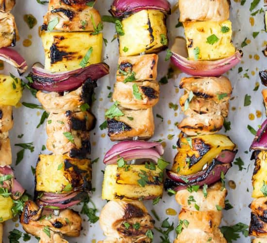 close up photo of grilled pineapple chicken kabobs