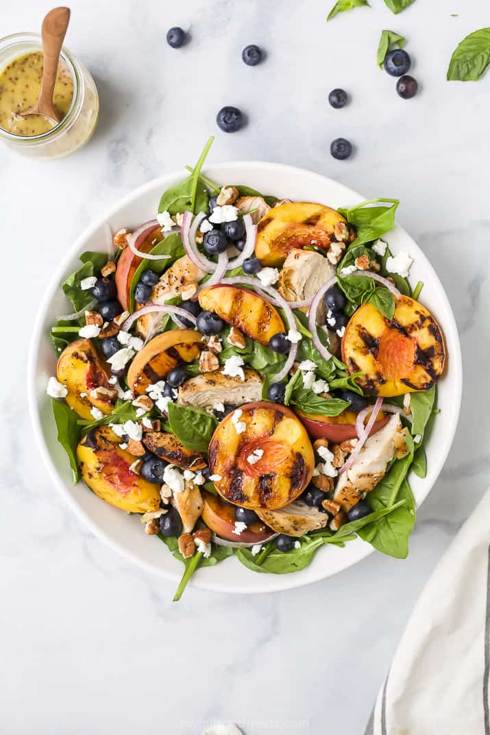 grilled peach chicken salad in a bowl