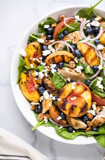 grilled peach chicken salad in a bowl