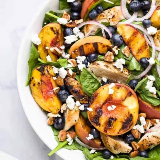 grilled peach chicken salad in a bowl