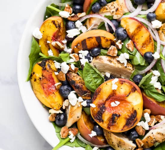 grilled peach chicken salad in a bowl