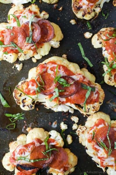 cauliflower steak pepperoni pizzas topped with fresh basil