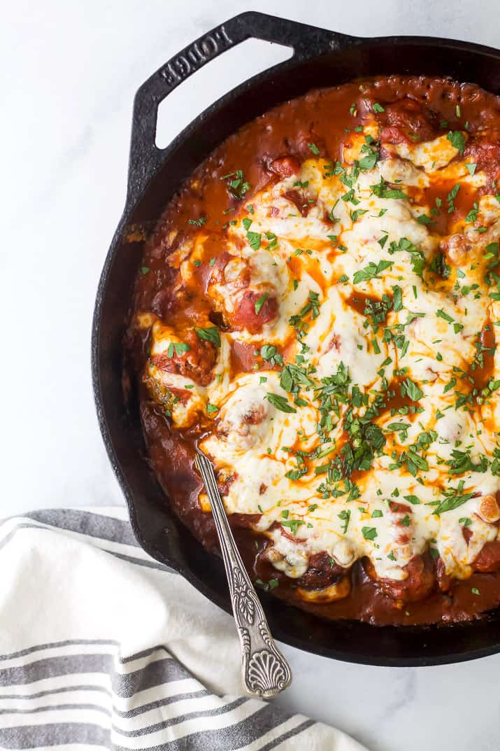 cheesy keto turkey meatballs baked in marinara sauce in a skillet