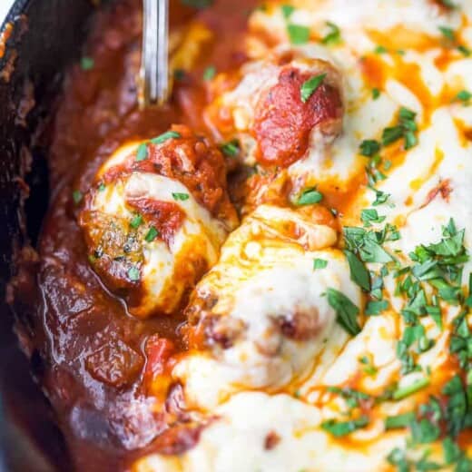 close up photo of cheesy keto turkey meatballs in a skillet