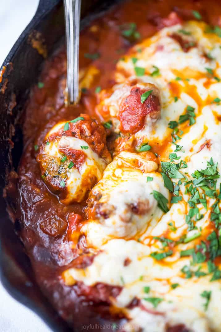 close up photo of cheesy keto turkey meatballs in a skillet