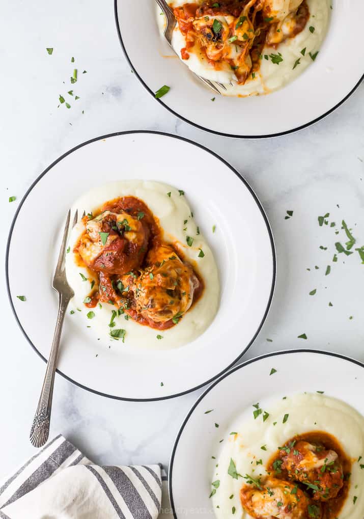 cheesy keto turkey meatballs on top of cauliflower puree 